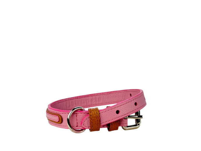 Pink dog collar with brown leather accents on a white background