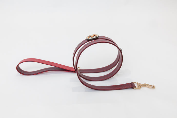 La dorada burgundy leather dog leash with red leather handle and gold plated hardware and letter pin